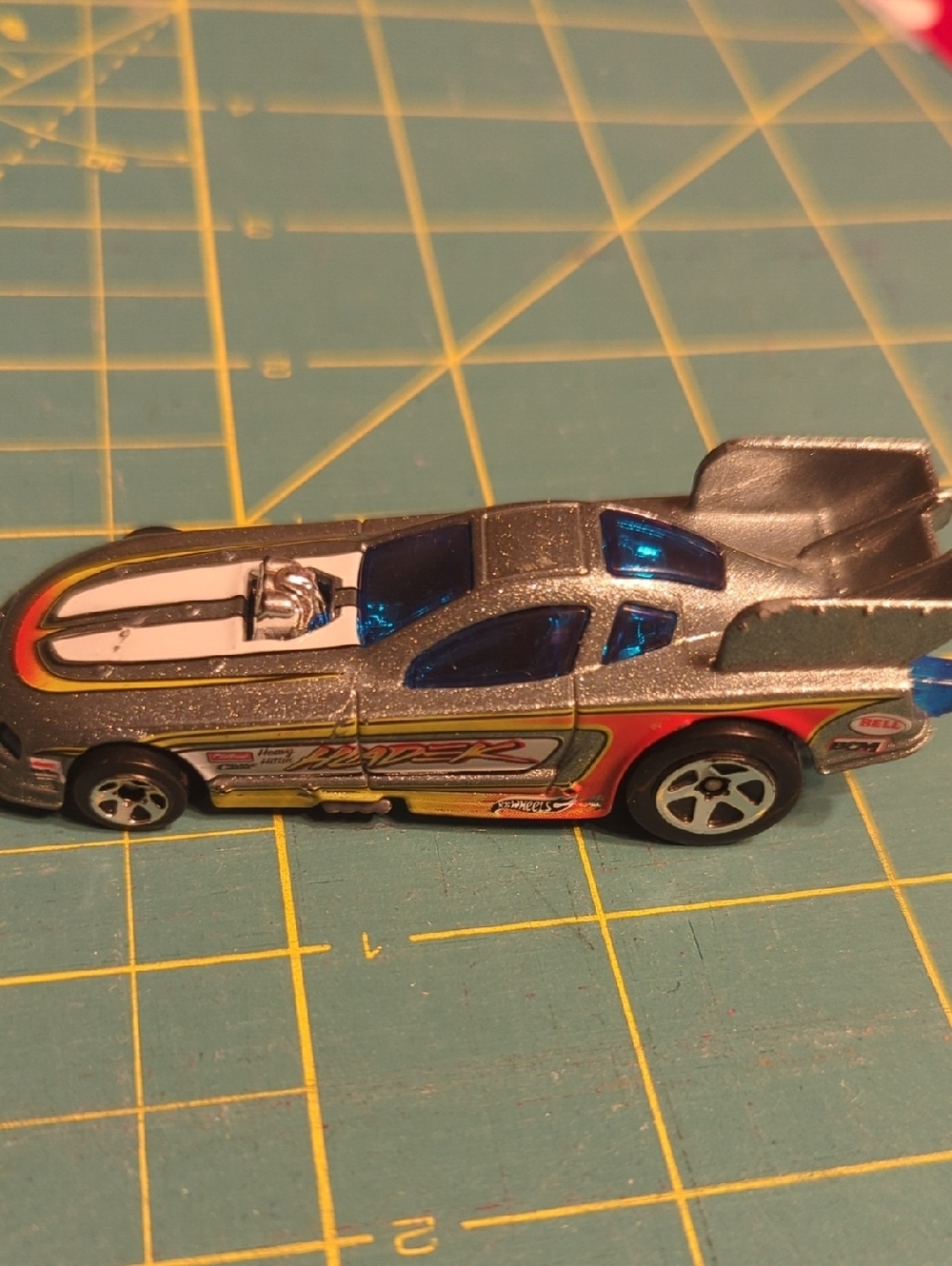 2010 Hot Wheels HLADEK Silver Racing Toy Car with Blue Windows and Red Accents